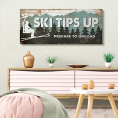 there is a sign that says ski tips up prepare to unload on the wall