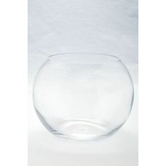 a clear glass bowl sitting on top of a white table