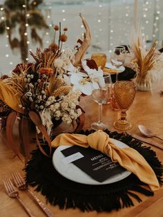 the table is set with an elegant centerpiece