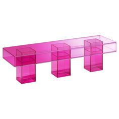 a pink table with three shelves on each side