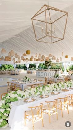 a large tent with tables and chairs set up for an event