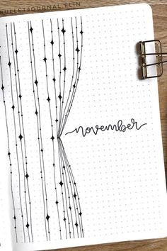 an open notebook with the word november written on it