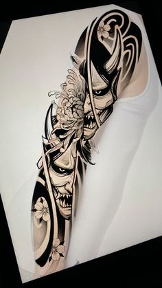 an artistic tattoo design on the arm