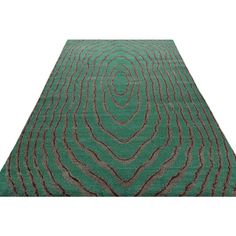 a green rug with brown lines on it