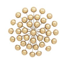 a golden metal object with many balls on it's centerpiece, against a white background