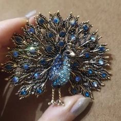 Exciting news for our peacock enthusiasts! Unveiling our latest treasure, the Sparkling Rhinestone Peacock Brooch – a mesmerizing embodiment of grace and elegance. Original and stylish, this beautiful peacock brooch is tailored for aficionados of peacock-inspired accessories! An elegant shimmering jewel that captures the allure of a peacock's majestic beauty. Its iridescence comes to life through meticulously arranged glistening rhinestones that shimmer with your every move ~ We love how the int Elegant Peacock Design Wedding Brooch, Elegant Peacock Design Brooch For Wedding, Wedding Brooch With Peacock Design, Elegant Wedding Brooch With Peacock Design, Elegant Party Brooch With Peacock Design, Elegant Peacock-colored Brooches For Wedding, Elegant Peacock Color Wedding Brooches, Elegant Peacock Brooches For Wedding, Elegant Peacock Color Party Brooches