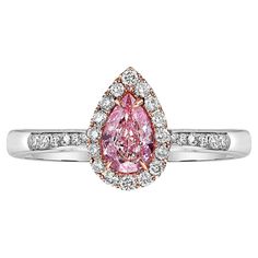 0.50ct center pear shape SI1 clarity GIA certified Very Light Pinkish Brown set with Pink enamel underneath to give it a very pink look Set in 18k white gold Exceptionally sweet color Designed for amazing value Making Extraordinary Attainable with Rare Colors Pink Pear-shaped Ring For Formal Occasions, Pear Shaped Pink Ring For Formal Occasions, Formal Pink Pear-shaped Diamond Ring, Pink Pear-shaped Formal Rings, Formal Pink Pear-shaped Rings, Pink Pear-shaped Diamond Ring With Halo Setting, Pink Pear-shaped Rings With Diamond Accents, Pink Pear-shaped Halo Diamond Ring, Pink Pear-shaped Diamond Ring With Prong Setting