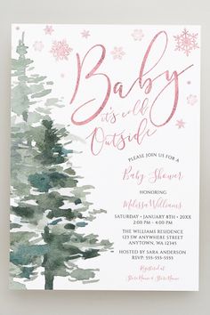 a baby is in the forest with snowflakes on it's head and pink lettering