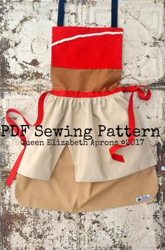 the apron is made out of two different fabrics, one with red and tan trim