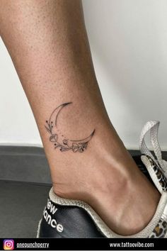 a woman's foot with a tattoo on it