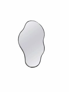 a mirror that is on the wall in front of a white background with an oval shape