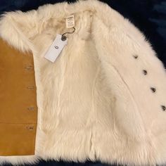 Authentic Ugg Renee Toscana Shearling Leather Jacket Vest Size: Xs Color: Chestnut Retail $995 New Without Tags Details: Luxe Toscana Twinface Looks Cooly Sophisticated In This Reversible Vest. Capture The Bohemian Mood Of The Season. Incredibly Soft. * Toscana Twinface * Front Button Closures * This Product Contains Real Fur From Sheep Or Lamb. Fur May Be Sourced From Australia, Ireland, The United Kingdom, Or The United States. * Made In Turkey. Brand New Without Tag, Never Worn. Winter White Sheepskin Fur Coat For Fall, Cream Shearling Fur Coat For Fall, Winter White Shearling Outerwear, White Shearling Outerwear For Winter, White Shearling Long Sleeve Outerwear, White Shearling Fur Coat, White Sheepskin Winter Outerwear, White Sheepskin Outerwear For Winter, White Sheepskin Fur Coat For Fall