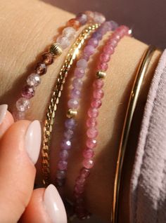 Named for how well these play (and stack) with others, these gemstone stretchy bracelets are handmade in Vancouver. Pink Tourmaline Bracelet: 3mm beads, 3mm 14k gold-filled bead detail Purple Sapphire Bracelet: 3mm beads, 3mm 14k gold-filled bead detail Spinel Bracelet: 4mm beads, 4mm 14k gold-filled bead detail Details Each piece of Leah Alexandra jewellery is handmade in her Vancouver beachside studio. Only the finest materials are used, including 14k gold fill, sterling silver, and carefully Delicate Stackable Beaded Bracelets For Everyday, Delicate Stackable Everyday Beaded Bracelets, Delicate Faceted Beaded Bracelets For Everyday, Adjustable Faceted 14k Gold Filled Bracelets, Dainty Faceted Beaded Bracelets For Everyday Wear, Dainty Stackable Rondelle Bracelets, Elegant Pink Stretch Bracelet For Everyday, Dainty Stretch Bracelet With Faceted Beads For Gift, Pink Faceted Beads Jewelry For Everyday