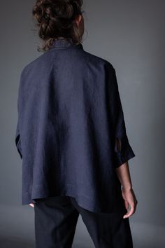 the back view of a woman wearing a dark blue shirt