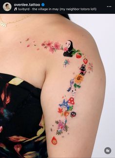 a woman with tattoos on her arm and shoulder