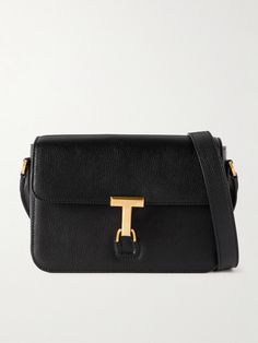 A sophisticated messenger bag like TOM FORD's brings so much to an outfit. Suspended from a sleek shoulder strap, it's made from supple textured-leather and has a boxy shape with plenty of room for your wallet, sunglasses and cologne. The gold-tone 'T' clasp makes a great focal point. Modern Tan Bags For Everyday Luxury, Timeless Tan Shoulder Bag For Office, Tan Leather Flap Bag For Office, Timeless Tan Shoulder Bag For Work, Formal Tan Flap Shoulder Bag, Tan Shoulder Bag With Palladium Hardware For Work, Formal Tan Satchel Shoulder Bag, Business Tan Shoulder Bag With Palladium Hardware, Tan Textured Leather Shoulder Bag For Work