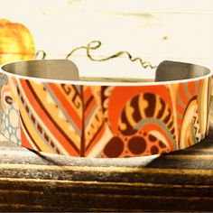 .75” Wide Metal Adjustable Cuff-Bend To Fit Dye Print Graphic Design-Will Not Fade Adjustable Yellow Bangle For Gift, Adjustable Orange Cuff Bracelet, Adjustable Multicolor Cuff Bracelet, Handmade Orange Adjustable Cuff Bracelet, Handmade Adjustable Orange Cuff Bracelet, Adjustable Yellow Cuff Bracelet As Gift, Adjustable Yellow Cuff Bracelet For Gift, Adjustable Orange Bangle As Gift, Adjustable Orange Bangle For Gift