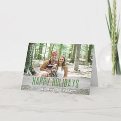 a card with the words happy holidays on it