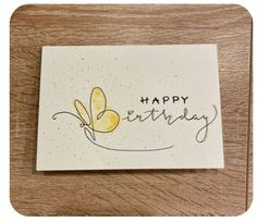 a card with the words happy birthday written in cursive writing and a butterfly on it