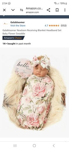 a newborn baby wrapped in a blanket and wearing a headband is shown on the amazon page