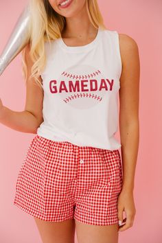 Score a home run with this playful Baseball Gameday Tank! The white tank features a "Take Me Out To The Ball Game" ribbon on the back, while the front boasts a fun baseball gameday design. Whether you're actually at the game or just lounging at home, this tank is a fun and quirky addition to your wardrobe. All orders are currently shipping within 14 business days. To receive item quicker, expedited shipping is available at checkout. Cotton Tank Top For Sports Season, Casual White Tank Top For Game Day, Team Spirit White Sleeveless Tank Top, White Sleeveless Tank Top For Team Spirit, Sleeveless Varsity Top For Game Day, White Sporty Tank Top For Game Day, White Cotton Tank Top For Game Day, Gameday Design, Plaid Boxers