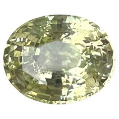 an oval shaped yellow diamond on a white background