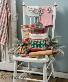 an old chair is decorated with christmas stockings and other items