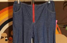 "Big Red Zipper Ladies Blue Denim Jeans Cotton denim fabric Tan stitching accent Front pockets Measurements in inches: 32\" waist 36\" hips 29\" inseam 19\" thigh 20\" leg cuff circumference 3\" hem 39\" side waist to hemline 7\" zipper" Fitted Denim Blue Pants With Zipper Closure, Fitted Denim Blue Flare Jeans With Zipper, Fitted Denim Blue Flare Jeans With Zipper Closure, Fitted Denim Flare Jeans With Zipper, Fitted Denim Flare Jeans With Zipper Closure, Fitted Flare Jeans With Zipper Closure, Fitted Medium Wash Pants With Zip Fly, Retro Fitted Bottoms With Button Zip Fly, Fitted Cotton Jeans With Zipper Closure