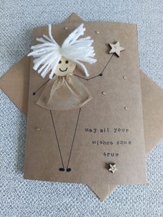 a card with an angel on it and some stars around the edges that says, may all your wishes come true