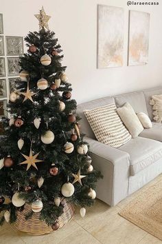 a living room with a christmas tree in the corner