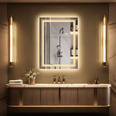 a bathroom with a sink, mirror and lights on the wall above it's counter