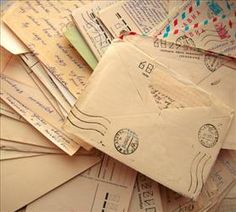 many old envelopes are piled on top of each other and have been used for mailing