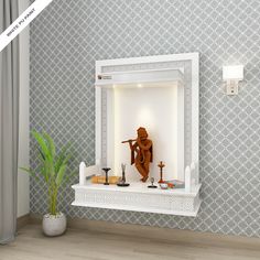 a white shelf with a statue on top of it next to a potted plant