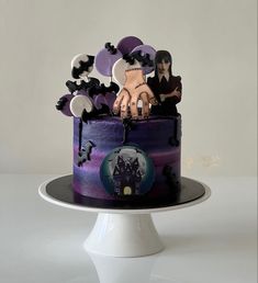 a halloween themed cake with spooky decorations