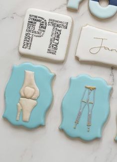 decorated cookies are displayed on a table with scissors, tape and other medical related items