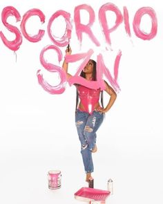 a woman holding a pink sign that says scorppo san on top of it