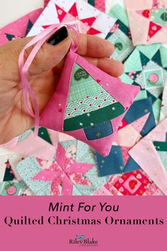 a hand holding a small christmas ornament with the words, mini for you quilted christmas ornaments