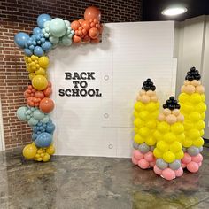 balloons are arranged in the shape of two bears with back to school written on them