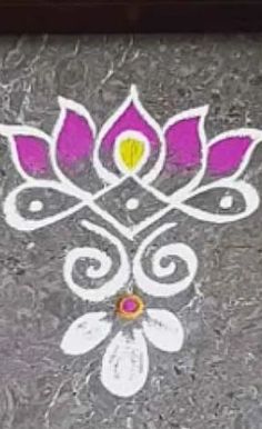 an artistic design painted on the ground with white and pink colors