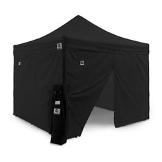 a black tent with the door open