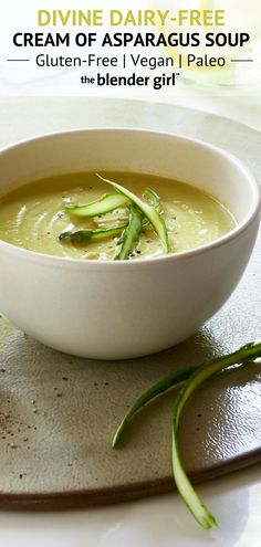 a white bowl filled with soup on top of a table