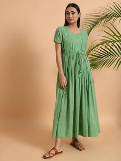 A free size long maxi dress with drawstring at the waist and double pockets Garment measurements (in Inches): Free Size: Bust: 50", Waist: 48", Length: 52" Fabric: Cotton Dobby Color: Green Fit: Model height is 5'7" Model is wearing a size S Loose and comfortable fit. Instructions: Hand wash separately in cold water Note: Available in other colors Pants not included with the product Pants can be bought separately This product will be shipped within 20-25 days of order placed. Casual Green Maxi Dress With Pockets, Casual Maxi Dress With Drawstring For Beach, Casual Beach Maxi Dress With Drawstring, Casual Drawstring Maxi Dress For The Beach, Green Maxi Dress With Pockets, Green Short Sleeve Maxi Dress With Pockets, Relaxed Fit Dresses With Drawstring And Short Sleeves, Spring Maxi Dress With Drawstring, Relaxed Fit Dress With Drawstring And Short Sleeves