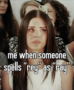 a woman sitting in front of a group of people with the caption me when someone spells'key as ray