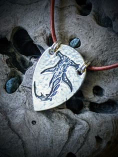 "You can find more silver treasures in my shop! Click here: https://www.etsy.com/shop/SeasideSilverJewels Or follow me on Facebook: https://www.facebook.com/SeasideSilverJewels/ Sharks are so fascinating to me. Especially the Hammerhead, possessing unique sensory abilities it uses to survive. This tribal design is inspired by my native heritage and my love for marine life. SIZE AND DETAIL: See pictures for dimensions. Each pendant contains approximately 4.5 grams of fine silver. I handcraft each Beach Pendant Jewelry With Engraving, Beach Engraved Pendant Jewelry, Nickel Free Silver Jewelry For The Beach, Nickel-free Silver Jewelry For The Beach, Adjustable Engraved Necklaces For Beach, Adjustable Engraved Necklaces For The Beach, Silver Engraved Necklace For Beach, Adjustable Sterling Silver Etched Necklace, Artisan Silver Necklaces For Beach