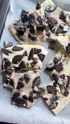 chocolate chip cookies and oreo cookie dough on a baking sheet, ready to be eaten