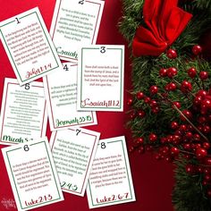 six christmas printables on top of a table with red berries and greenery