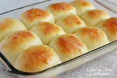 bread rolls in a glass baking dish ready to be baked