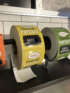 two rolls of toilet paper sitting on top of a counter