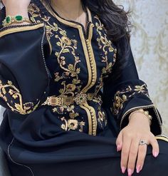 Moroccan Black Caftan , Embroidered and Hand Beaded . This item is made to order and can be personalised. Black Ceremonial Kaftan For Eid, Traditional Gold Embroidered Kaftan For Party, Traditional Party Kaftan With Gold Embroidery, Ceremonial Long Sleeve Gown, Festive Black Kaftan With Gold Embroidery, Black Embroidered Long Sleeve Gown, Black Long Sleeve Embroidered Gown, Elegant Long Sleeve Dresses With Handwork, Embroidered Black Kaftan For Traditional Ceremonies