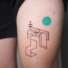 a person with a green dot on their left knee and an abstract tattoo design on his right thigh